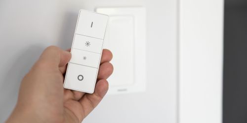 close-up-hand-holding-remote